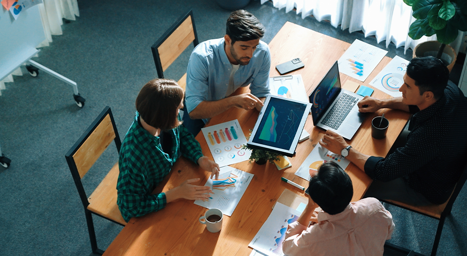 marketing team reviewing charts