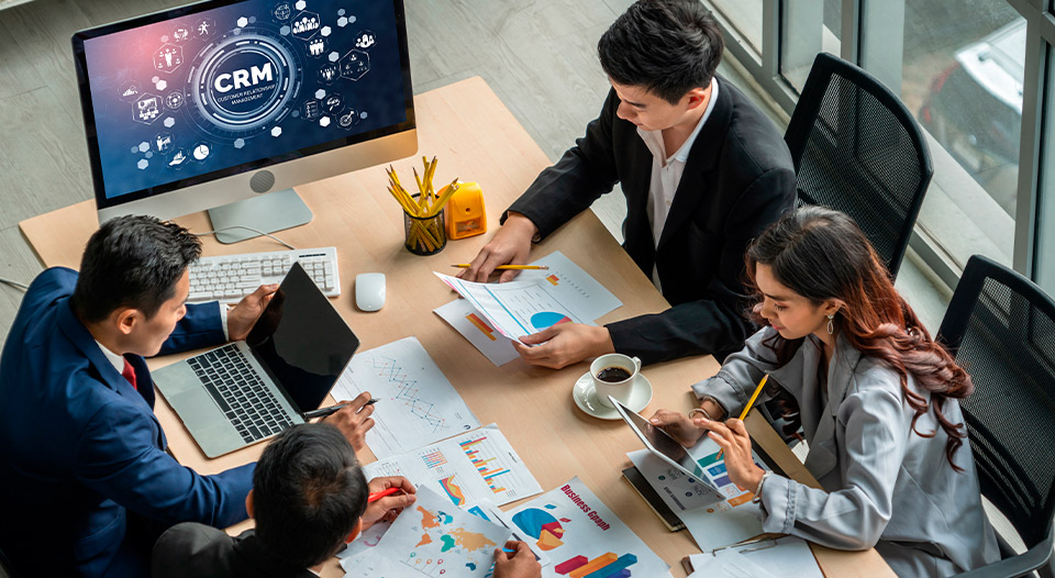 marketing team working together. Checking laptop, notes, charts, etc. 